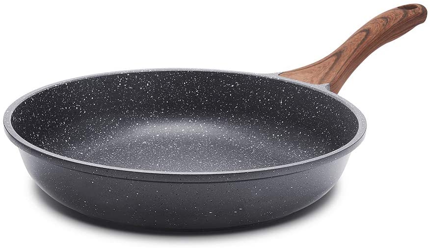 A black colour non-stick pan with a wooden handle
